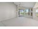 Living area with carpet, sliding glass doors, and pool access at 3853 Bordeaux Dr, Punta Gorda, FL 33950