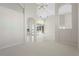Open concept living area with tile and carpeted floors at 3853 Bordeaux Dr, Punta Gorda, FL 33950
