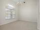 Bright office space with carpet floors and arched window at 3853 Bordeaux Dr, Punta Gorda, FL 33950