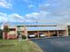 Two-story condo building with covered parking and lush landscaping at 1354 Rock Dove Ct # A202, Punta Gorda, FL 33950