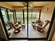 Spacious screened balcony with comfortable seating and water views at 1354 Rock Dove Ct # A202, Punta Gorda, FL 33950