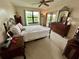 Comfortable bedroom with a full-size bed and access to balcony at 1354 Rock Dove Ct # A202, Punta Gorda, FL 33950