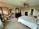 Bright bedroom with a comfortable bed and access to a private balcony at 1354 Rock Dove Ct # A202, Punta Gorda, FL 33950