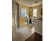 Cozy breakfast nook with a glass-top table and white chairs at 17434 Boca Vista Rd # 1006, Punta Gorda, FL 33955