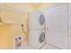 Laundry room with washer, dryer, and shelving at 17434 Boca Vista Rd # 1006, Punta Gorda, FL 33955