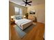 Bright bedroom with hardwood floors and a comfortable bed at 17434 Boca Vista Rd # 1006, Punta Gorda, FL 33955