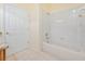 Bathroom with tiled tub/shower and neutral colors at 17434 Boca Vista Rd # 1006, Punta Gorda, FL 33955