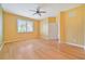 Bright bedroom with wood flooring, ceiling fan, and large window at 17434 Boca Vista Rd # 1006, Punta Gorda, FL 33955