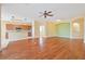 Open living room and kitchen with hardwood floors at 17434 Boca Vista Rd # 1006, Punta Gorda, FL 33955