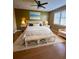 Relaxing main bedroom with a comfortable bed and wicker accents at 17434 Boca Vista Rd # 1006, Punta Gorda, FL 33955