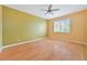 Spacious bedroom with wood flooring and ceiling fan at 17434 Boca Vista Rd # 1006, Punta Gorda, FL 33955