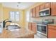 Kitchen features granite countertops, stainless steel appliances, and a double sink at 17434 Boca Vista Rd # 1006, Punta Gorda, FL 33955
