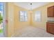 Bright breakfast nook with tile flooring and view to backyard at 17434 Boca Vista Rd # 1006, Punta Gorda, FL 33955