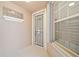 Inviting front door entry with security screen and window at 17434 Boca Vista Rd # 1006, Punta Gorda, FL 33955