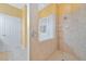 Large walk-in shower with tile surround and built-in shelving at 17434 Boca Vista Rd # 1006, Punta Gorda, FL 33955