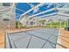 Community pool with covered patio and lounge chairs at 17434 Boca Vista Rd # 1006, Punta Gorda, FL 33955