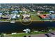 Waterfront home features a private dock, pool, tropical landscaping and serene canal views at 1429 Blue Jay Ct, Punta Gorda, FL 33950