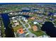 Aerial view of waterfront property featuring lush tropical landscaping and waterfront access at 1429 Blue Jay Ct, Punta Gorda, FL 33950