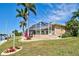 This waterfront property boasts a screened lanai, lush landscaping, and a beautiful backyard at 1429 Blue Jay Ct, Punta Gorda, FL 33950