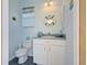 Charming half bathroom with nautical decor, offering convenience for guests and poolside access at 1429 Blue Jay Ct, Punta Gorda, FL 33950