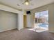 Cozy bedroom with carpeted floors, closet, and sliding doors leading to the screened lanai and pool area at 1429 Blue Jay Ct, Punta Gorda, FL 33950