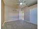 Bedroom with carpet, ceiling fan and access to a bathroom at 1429 Blue Jay Ct, Punta Gorda, FL 33950