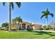 Well-maintained single-Gathering home with beautiful landscaping, mature palms and inviting curb appeal at 1429 Blue Jay Ct, Punta Gorda, FL 33950