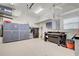 Spacious garage with epoxy floor, workbench, built-in storage cabinets, and overhead storage at 1429 Blue Jay Ct, Punta Gorda, FL 33950