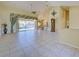 Spacious open living area with tiled flooring and view to the pool at 1429 Blue Jay Ct, Punta Gorda, FL 33950