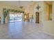 Open living room with access to outdoor pool and a breakfast bar at 1429 Blue Jay Ct, Punta Gorda, FL 33950