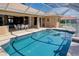 Beautiful swimming pool surrounded by a screened enclosure, with easy access to outdoor dining and relaxation areas at 1429 Blue Jay Ct, Punta Gorda, FL 33950