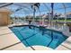 Gorgeous swimming pool within a screened lanai, perfect for enjoying the serene waterfront setting and Florida sunshine at 1429 Blue Jay Ct, Punta Gorda, FL 33950