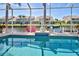 Sparkling pool with clear blue water, surrounded by a screened enclosure and beautiful waterfront views at 1429 Blue Jay Ct, Punta Gorda, FL 33950