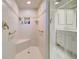 Shower stall featuring built in bench, shower head and safety bars at 1429 Blue Jay Ct, Punta Gorda, FL 33950