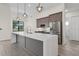 Modern kitchen with stainless steel appliances and a large island at 24237 San Lucas Ln, Punta Gorda, FL 33955