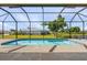 Screened pool with view of backyard and canal at 24237 San Lucas Ln, Punta Gorda, FL 33955