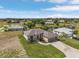 Single-Gathering home with a metal roof, two-car garage, and landscaped yard at 24237 San Lucas Ln, Punta Gorda, FL 33955