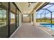 Spacious covered lanai with pool and sliding glass doors at 24237 San Lucas Ln, Punta Gorda, FL 33955