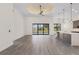 Open living space with tile floors, sliding glass doors, and a pool view at 24237 San Lucas Ln, Punta Gorda, FL 33955