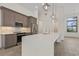 Modern kitchen with stainless steel appliances and large island at 24237 San Lucas Ln, Punta Gorda, FL 33955