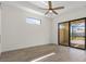 Bright bedroom with sliding glass doors to a screened-in patio at 24237 San Lucas Ln, Punta Gorda, FL 33955
