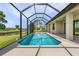 Screened pool with view of the backyard and water at 24237 San Lucas Ln, Punta Gorda, FL 33955