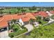 Aerial view of villas with tile roofs and lush landscaping at 5081 San Rocco Ct, Punta Gorda, FL 33950