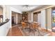 Charming dining area with wooden table and chairs, near the kitchen and patio at 5081 San Rocco Ct, Punta Gorda, FL 33950