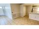 View of a dining area with tile flooring and access to the kitchen at 66 Wylam Dr, Port Charlotte, FL 33954