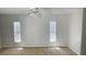Spacious bedroom with neutral walls, carpeting, and ceiling fan at 66 Wylam Dr, Port Charlotte, FL 33954