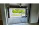 Screened-in porch overlooking backyard at 66 Wylam Dr, Port Charlotte, FL 33954