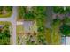 Aerial view of single-story house near canal at 66 Wylam Dr, Port Charlotte, FL 33954