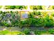 Aerial view of single-story house nestled in lush greenery at 66 Wylam Dr, Port Charlotte, FL 33954