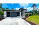 House exterior featuring a two car garage and curb appeal at 66 Wylam Dr, Port Charlotte, FL 33954